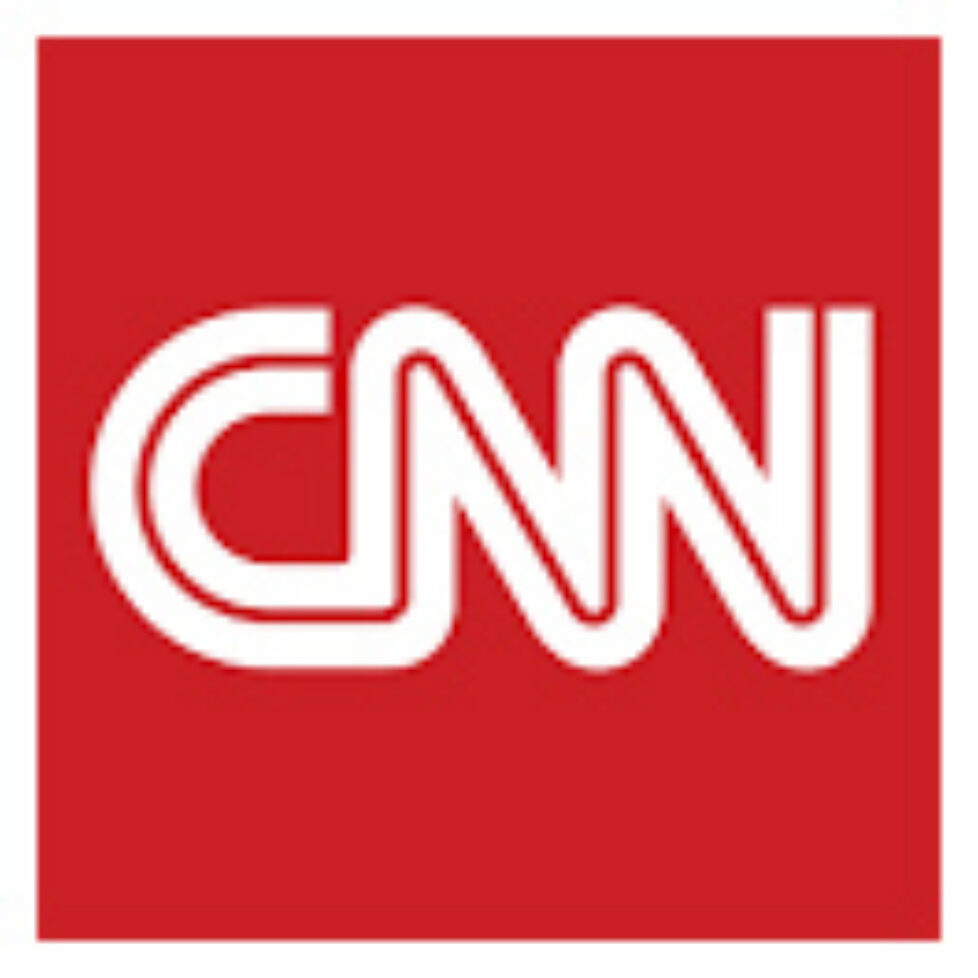 A red square with the cnn logo on it.